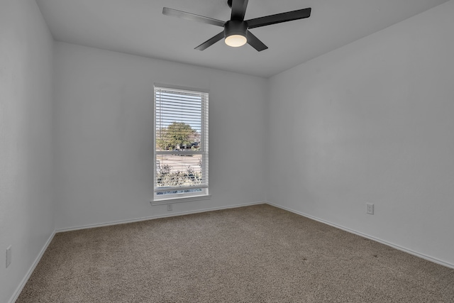 carpeted empty room with ceiling fan