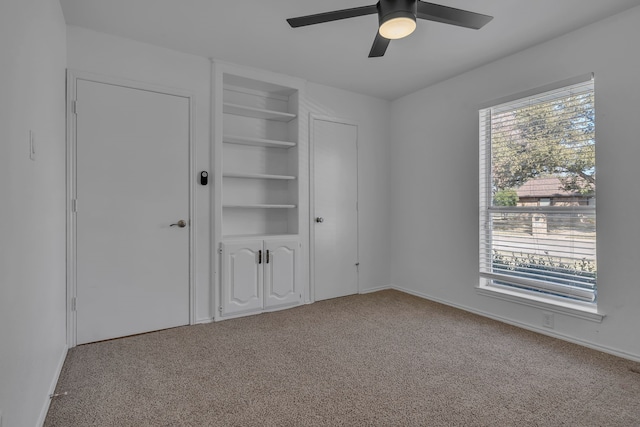 unfurnished bedroom with light carpet and ceiling fan