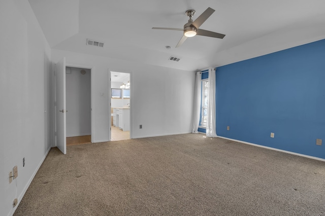 unfurnished bedroom featuring carpet flooring, ensuite bathroom, and ceiling fan