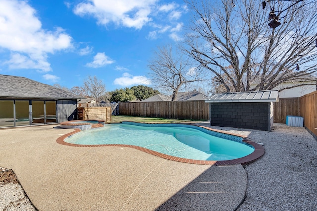 view of swimming pool featuring a patio area and an in ground hot tub