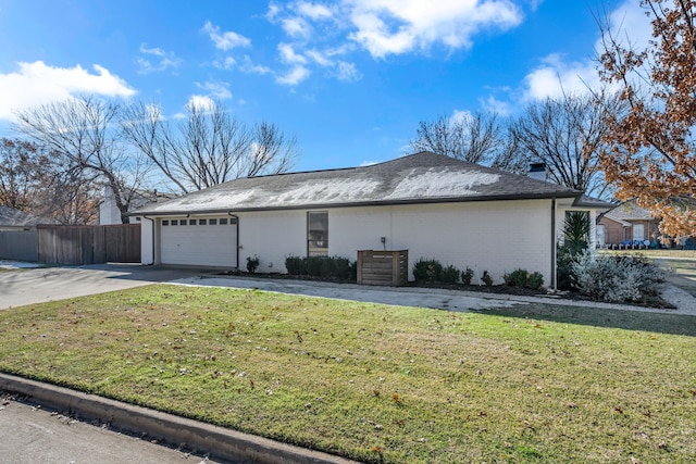 view of property exterior with a lawn and a garage