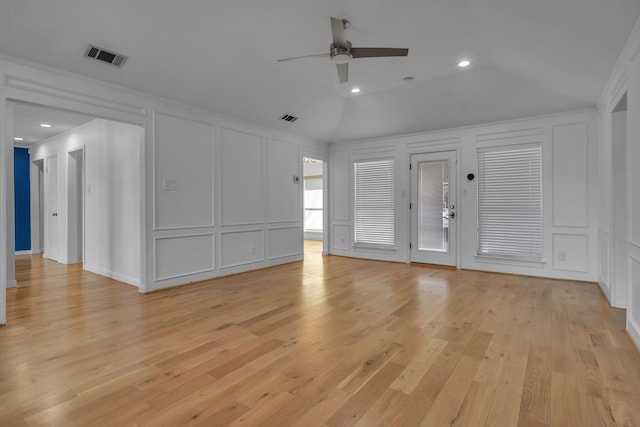 unfurnished living room featuring lofted ceiling, light hardwood / wood-style flooring, ceiling fan, and crown molding