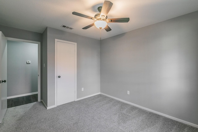 unfurnished bedroom with carpet floors, a closet, and ceiling fan