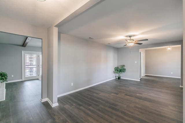 unfurnished room with dark wood-type flooring and ceiling fan