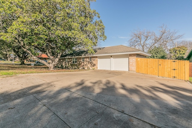 view of side of home featuring a garage