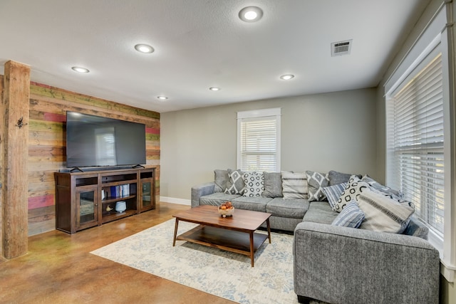 living room with wooden walls