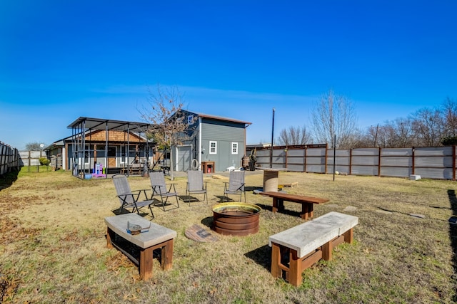 405 Hubbard, Josephine, TX 75173 - view of yard featuring a storage unit and an outdoor fire pit