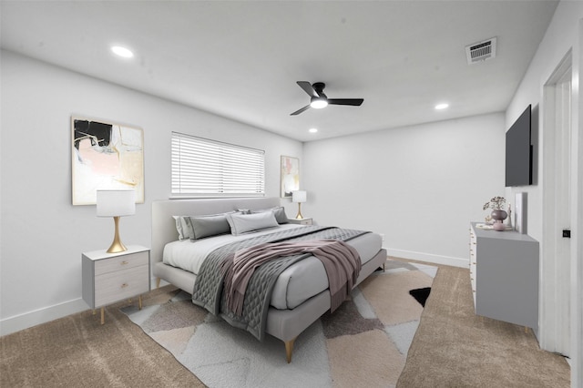 bedroom featuring ceiling fan and light colored carpet