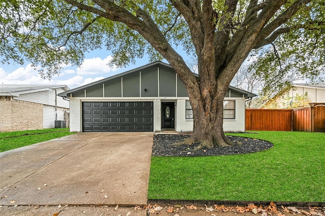 view of front facade with a front yard and a garage