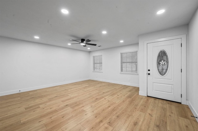 entryway with ceiling fan and light wood-type flooring