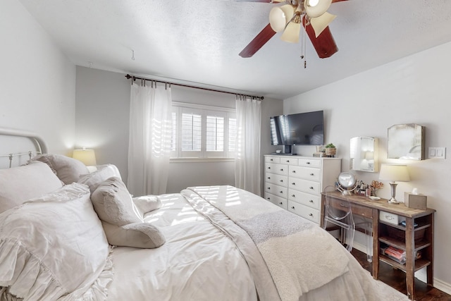 bedroom featuring a textured ceiling and ceiling fan