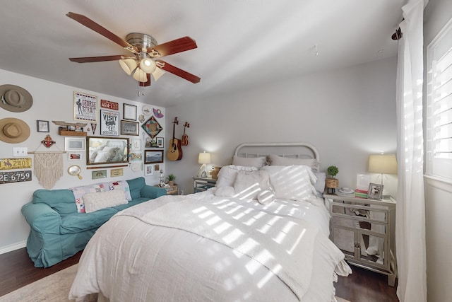 bedroom featuring ceiling fan and dark wood-type flooring