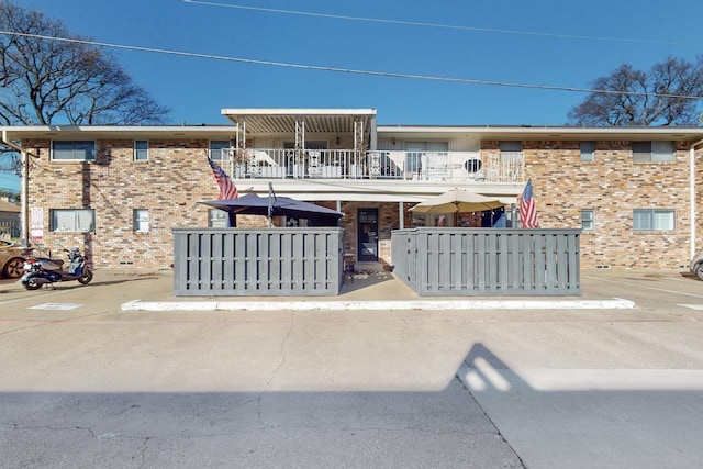 townhome / multi-family property with a balcony