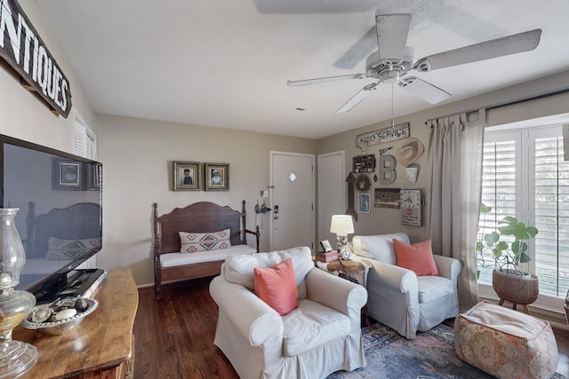 living room with dark hardwood / wood-style floors and ceiling fan