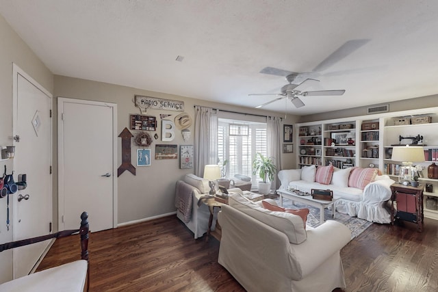 living room featuring a textured ceiling, dark hardwood / wood-style flooring, and ceiling fan