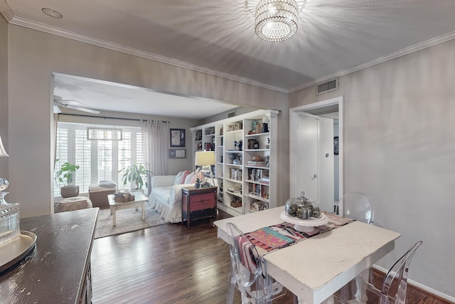 dining room featuring ceiling fan with notable chandelier, dark hardwood / wood-style floors, and ornamental molding