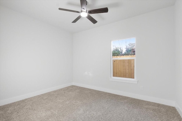 spare room featuring carpet and ceiling fan