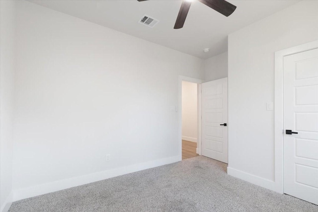 unfurnished bedroom featuring light colored carpet and ceiling fan