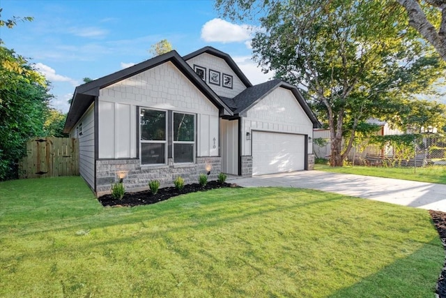 view of front facade with a garage and a front lawn