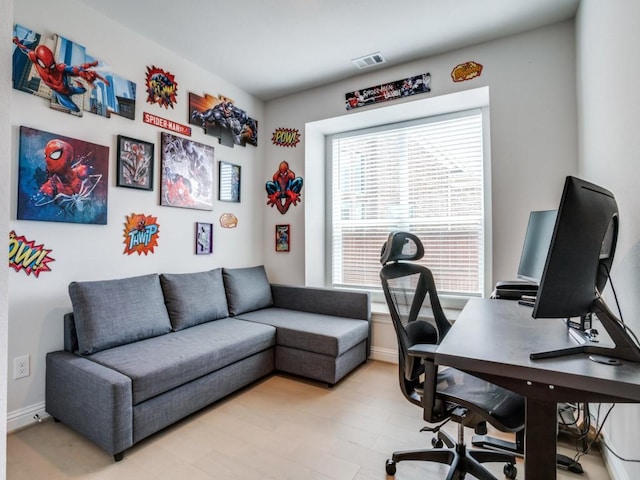 office area featuring light hardwood / wood-style flooring and a wealth of natural light