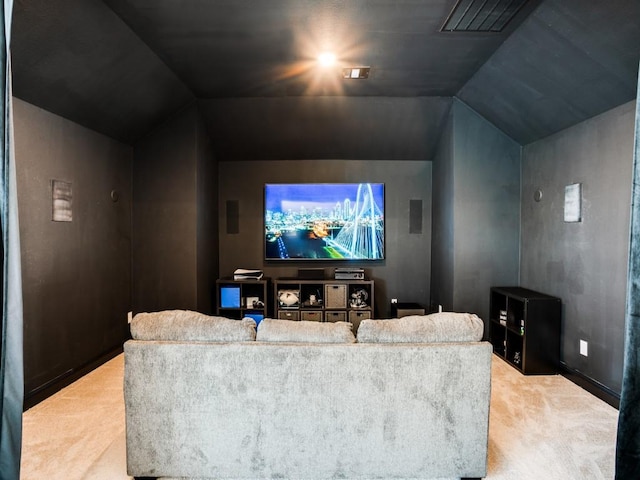 carpeted cinema featuring vaulted ceiling