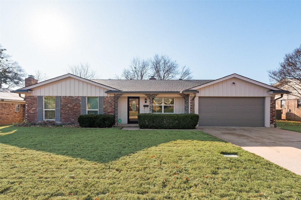 ranch-style house with a front yard and a garage