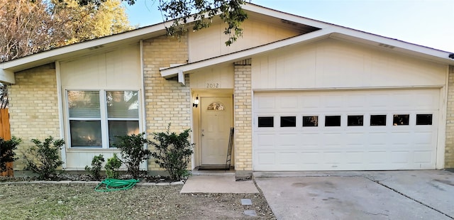 ranch-style house featuring a garage