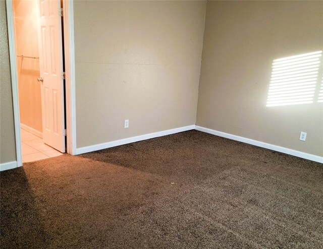 empty room featuring light carpet