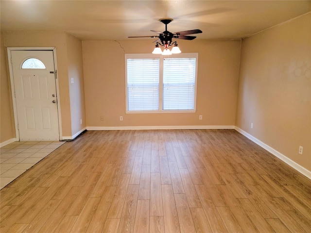 foyer entrance featuring ceiling fan and light hardwood / wood-style floors