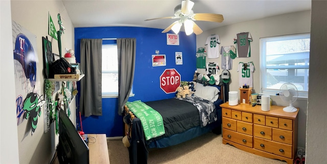 carpeted bedroom featuring ceiling fan