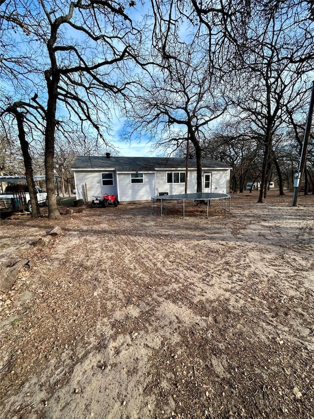 back of property with a trampoline