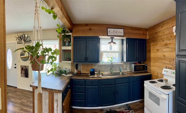 kitchen featuring dark hardwood / wood-style flooring, white range with electric stovetop, blue cabinets, sink, and pendant lighting