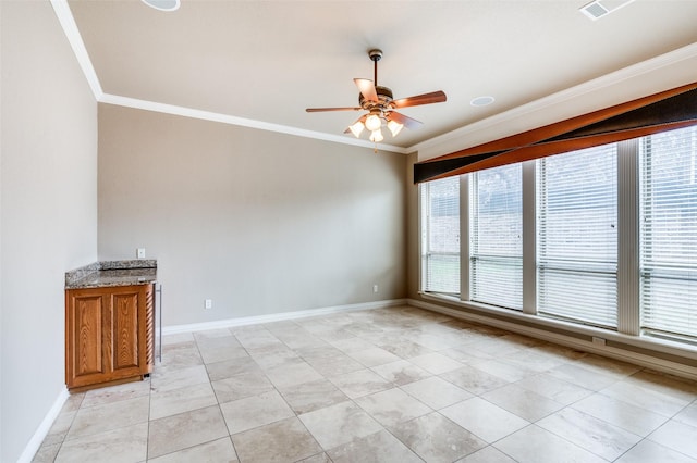 tiled spare room with crown molding and ceiling fan