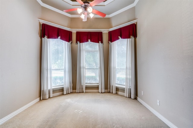 carpeted empty room with ornamental molding and ceiling fan