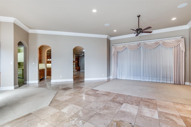 unfurnished living room featuring ornamental molding, light carpet, and ceiling fan