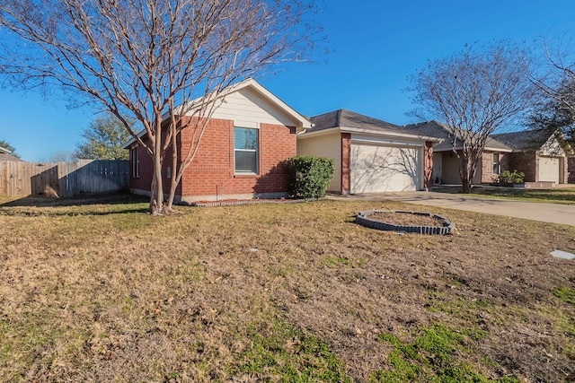 ranch-style home with a garage and a front yard