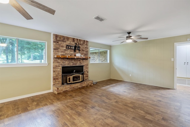 unfurnished living room with hardwood / wood-style flooring and ceiling fan