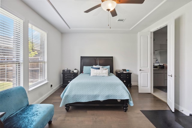 bedroom with ceiling fan and dark wood-type flooring