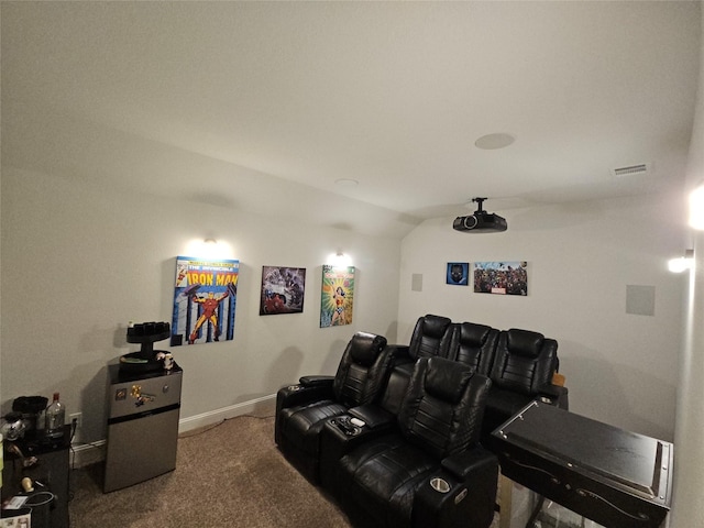 cinema featuring lofted ceiling and carpet floors