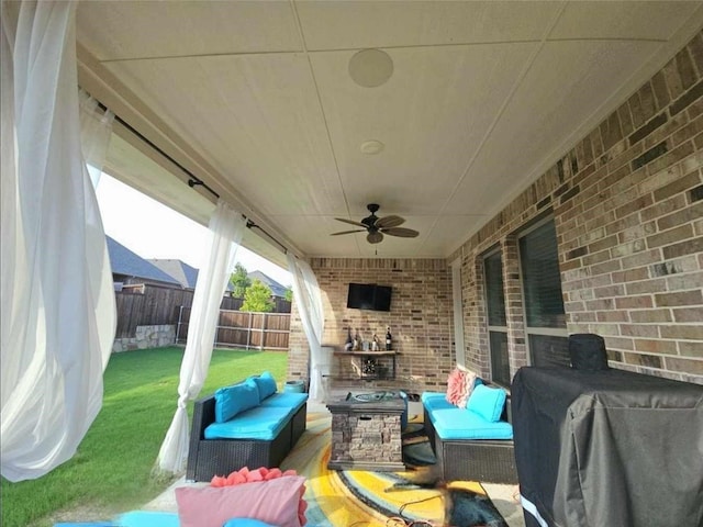 view of patio / terrace featuring a grill, ceiling fan, and an outdoor hangout area