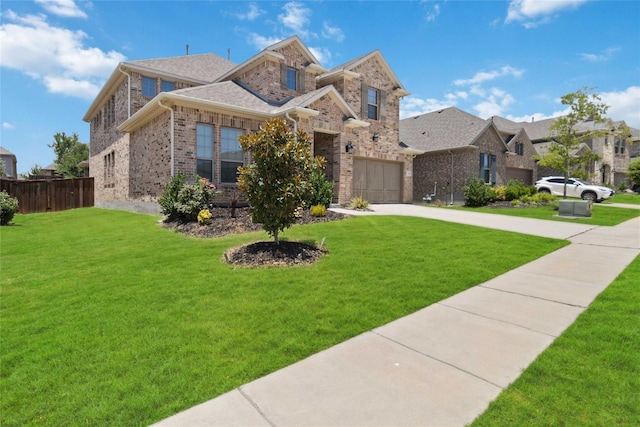 view of front of home featuring a garage and a front yard