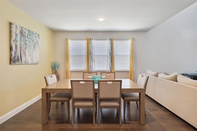 dining area featuring dark hardwood / wood-style flooring