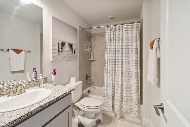 full bathroom with tile patterned floors, shower / bath combo with shower curtain, vanity, and toilet