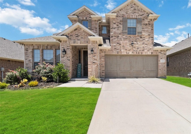 view of front of home with a garage and a front yard