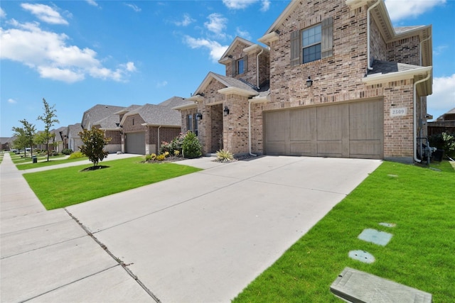 view of front of property with a front lawn and a garage