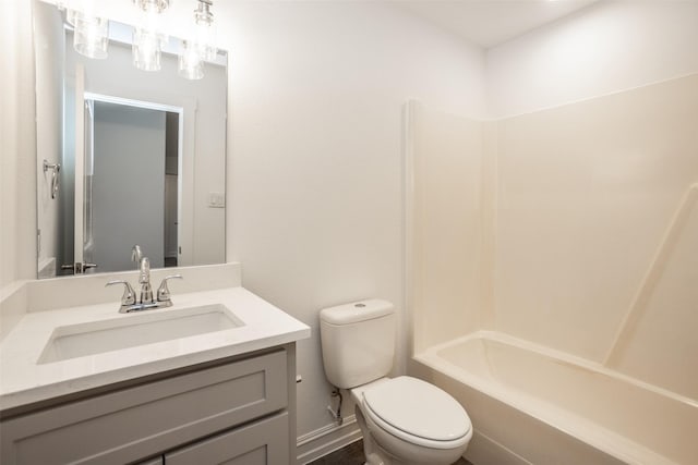 full bathroom featuring vanity, bathtub / shower combination, and toilet