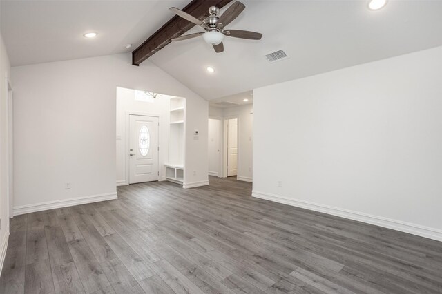 unfurnished living room featuring ceiling fan, hardwood / wood-style floors, and lofted ceiling with beams