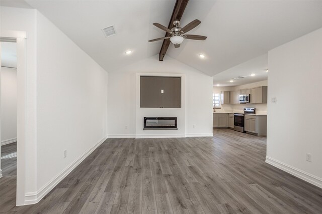 unfurnished living room with vaulted ceiling with beams, ceiling fan, and dark wood-type flooring