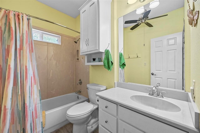 full bathroom with shower / bath combination with curtain, ceiling fan, toilet, and vanity