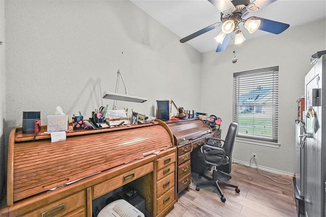 home office featuring ceiling fan and light hardwood / wood-style flooring